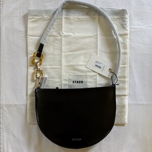STAUD Black Colt Shoulder Bag with Hammered Gold and Silver Chain Accent.